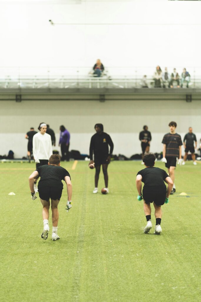 A group of people in black and white uniforms playing soccer